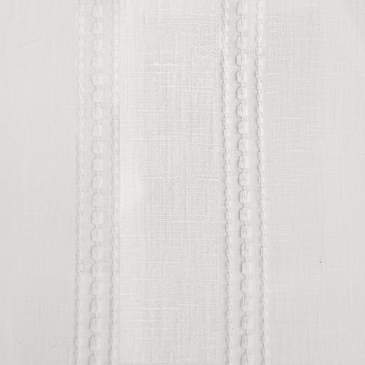 Online curtain fabric in ivory with embroidery.