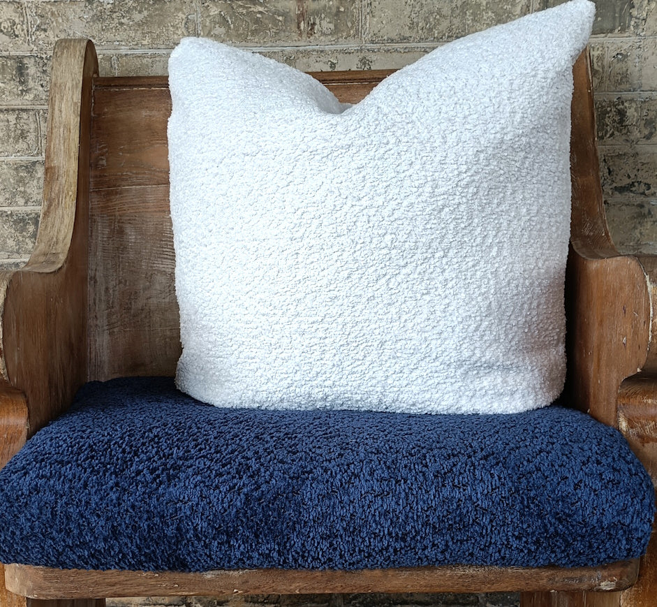 Boucle cushions on a bench