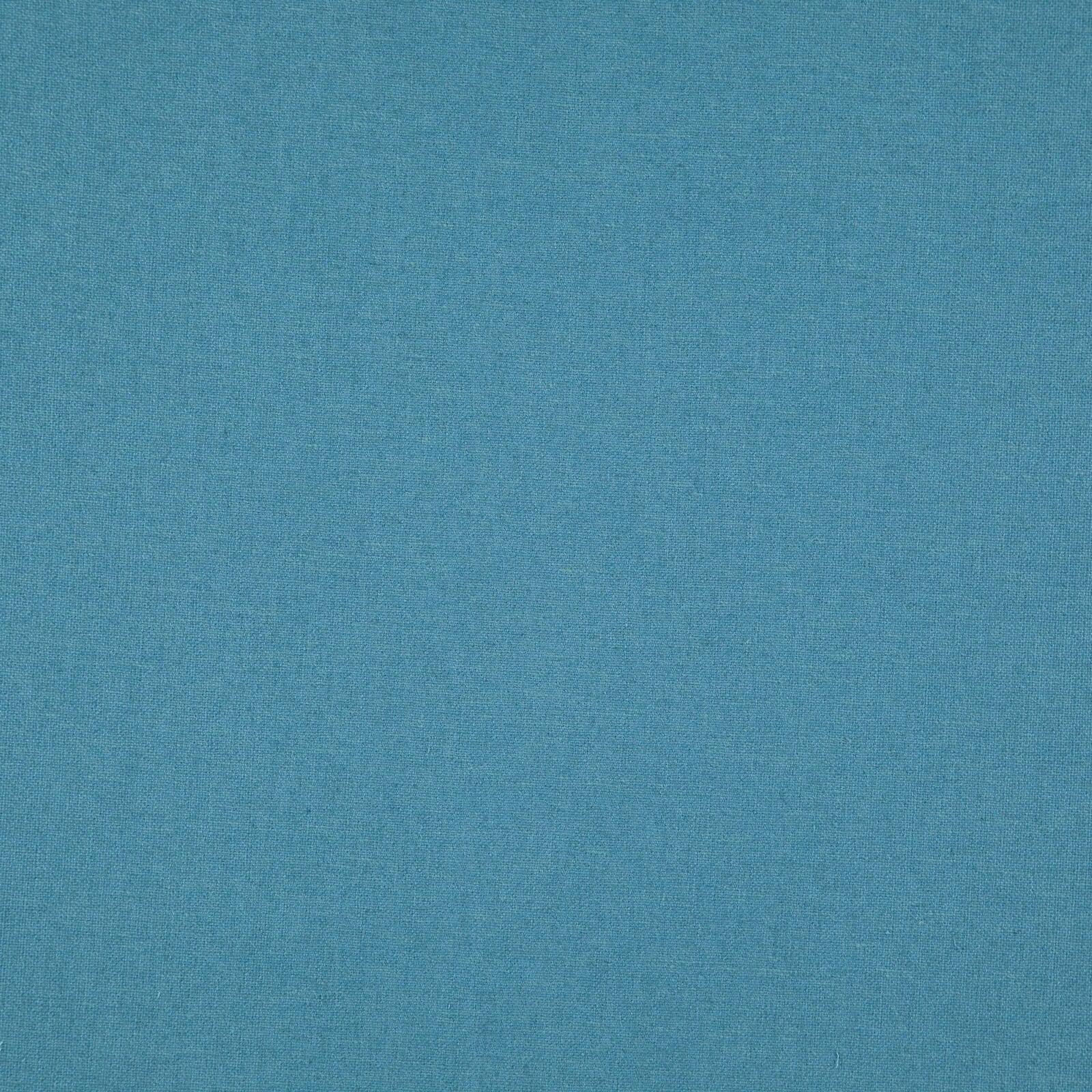 Linen upholstery fabric in turquoise color.