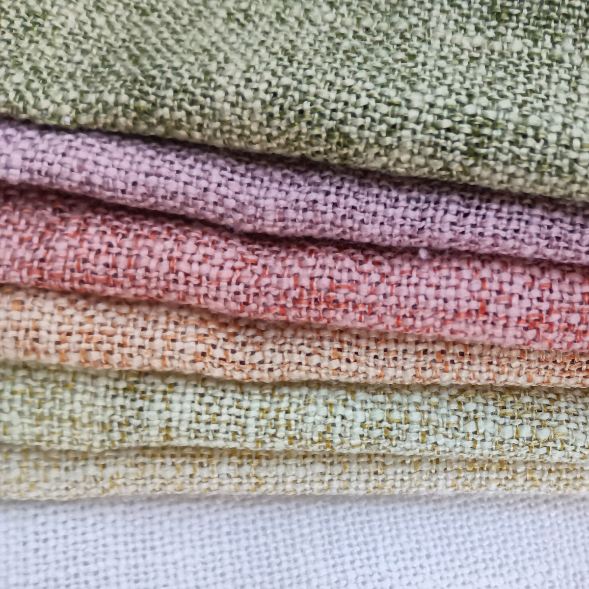 Linen curtain fabric by the yard in different shades.