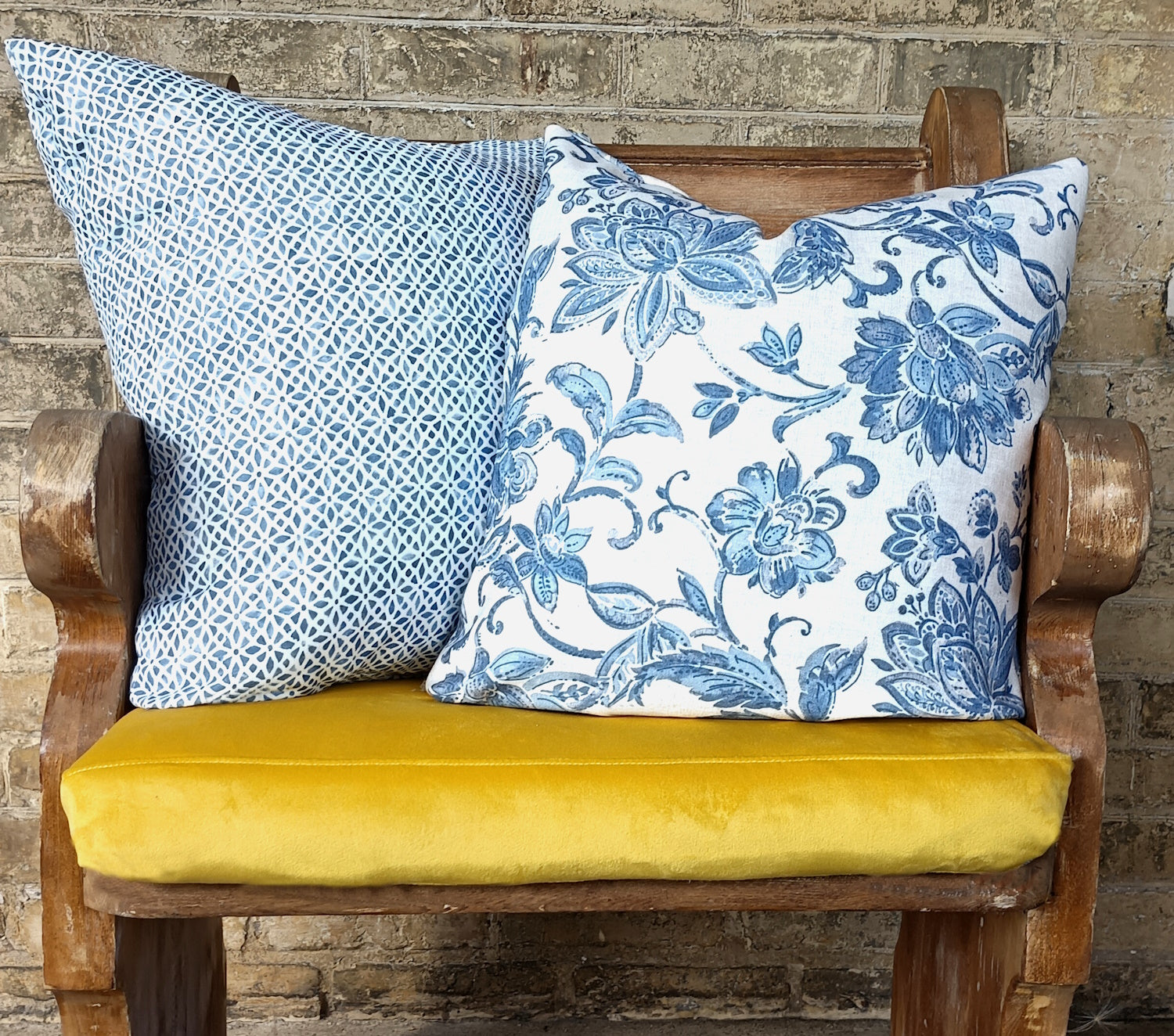 Blue and yellow cushions on bench.